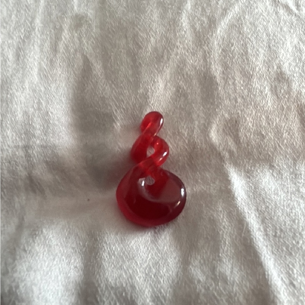 Red glass pendant in figure-eight knot design
